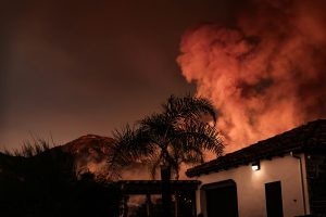 Home on street with wildfire, California wildfire, California wildfire mediation