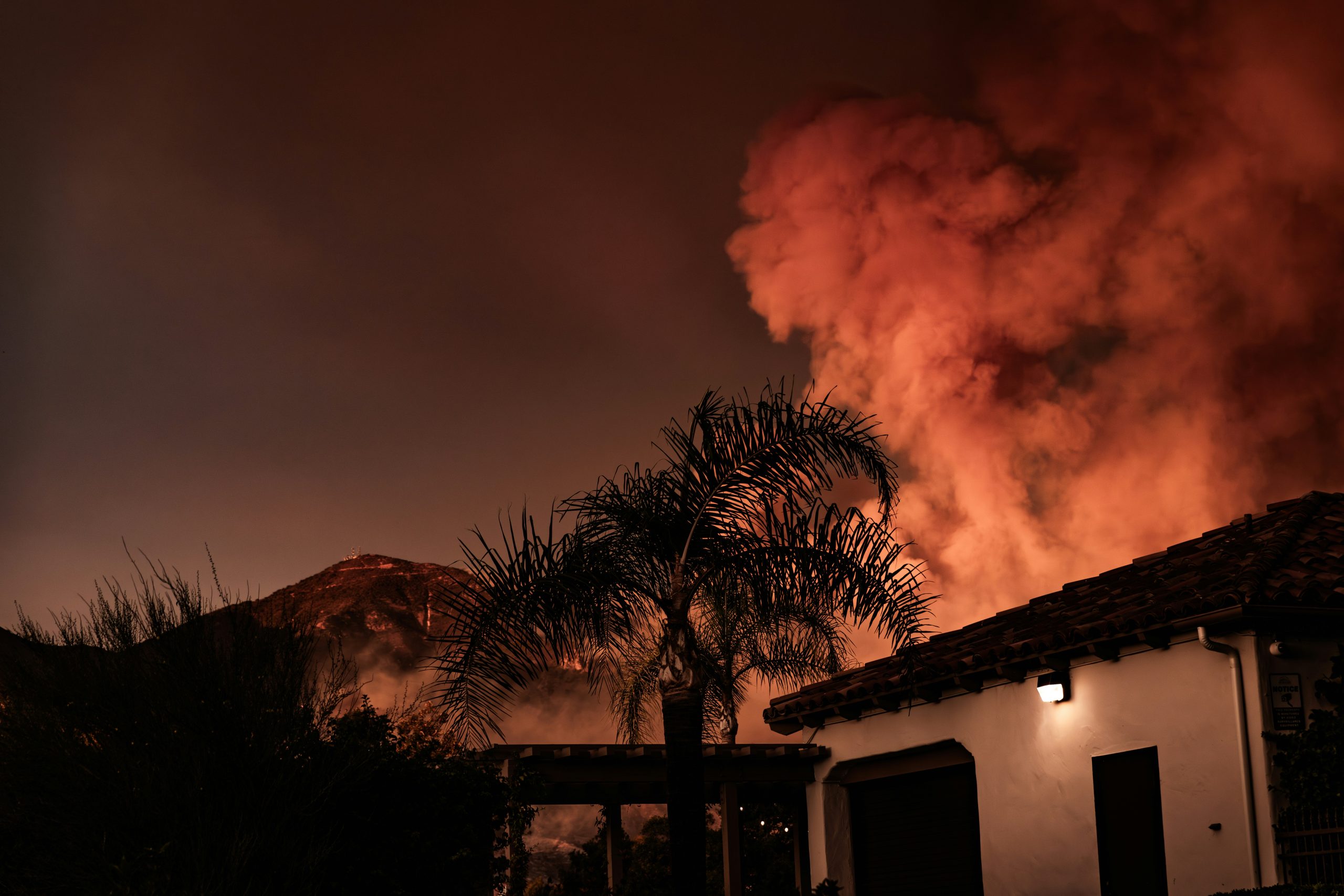 Home on street with wildfire, California wildfire, California wildfire mediation